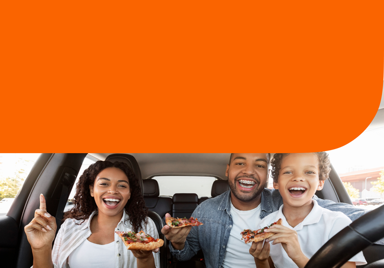 A family eating in their car
