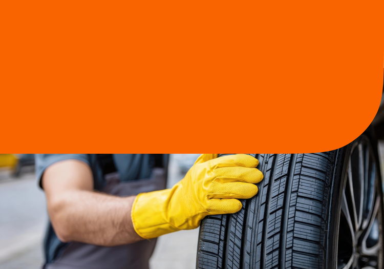 A man rotating a tire