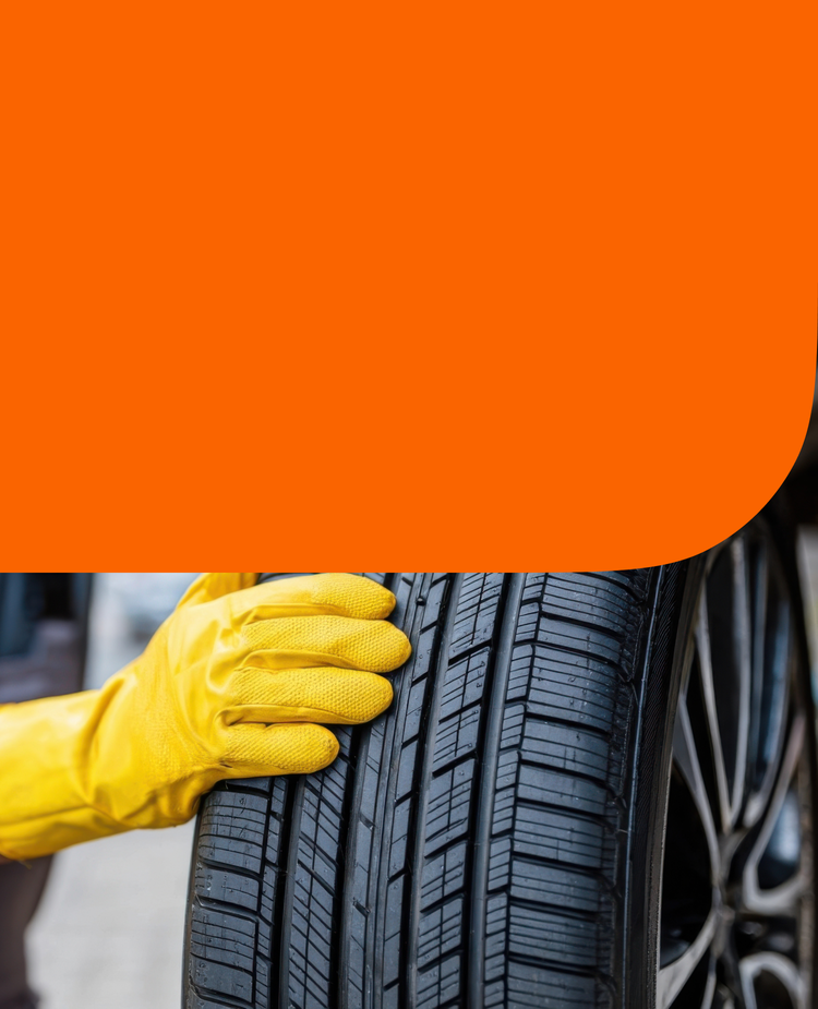 A man rotating a tire