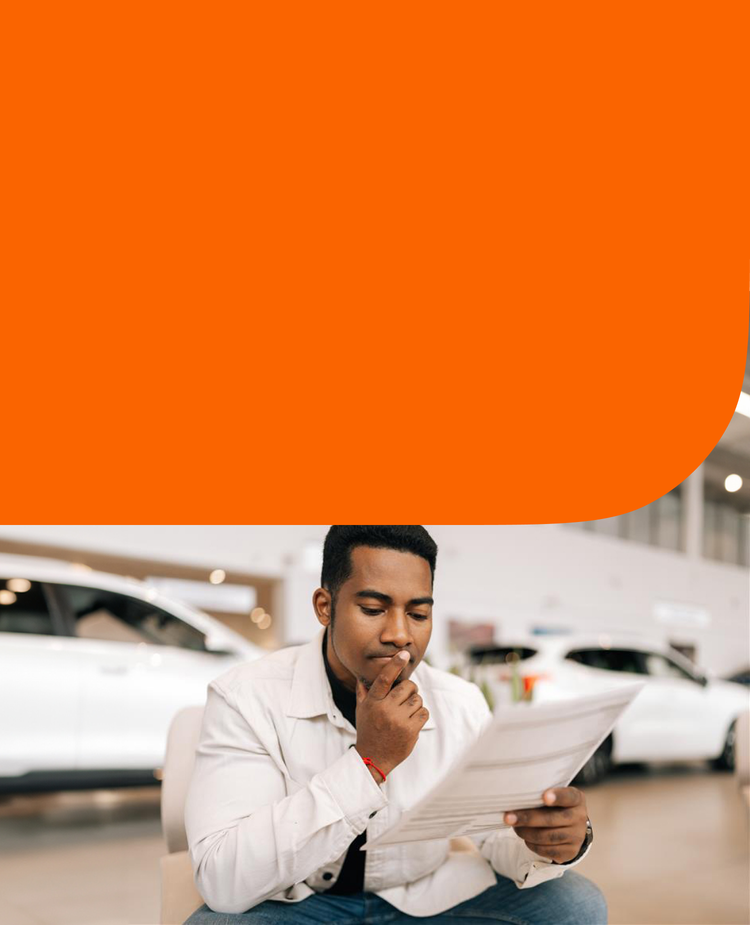 A man reading a vehicle history report