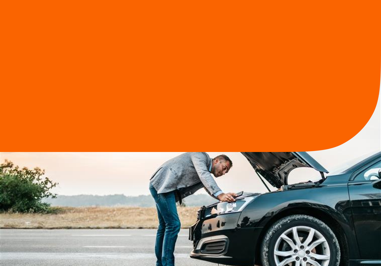 A man fixes his car.