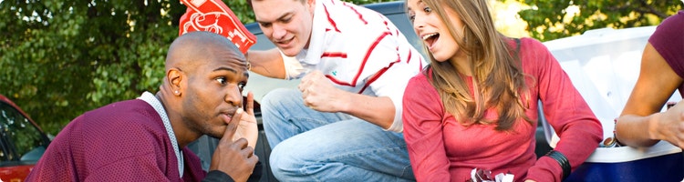 People tailgating in back of truck