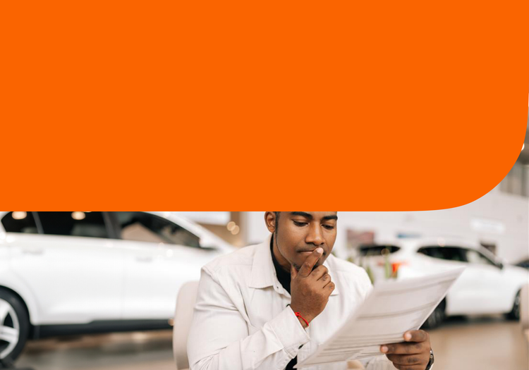 A man reading a vehicle history report