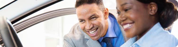 car dealer shows customer car features