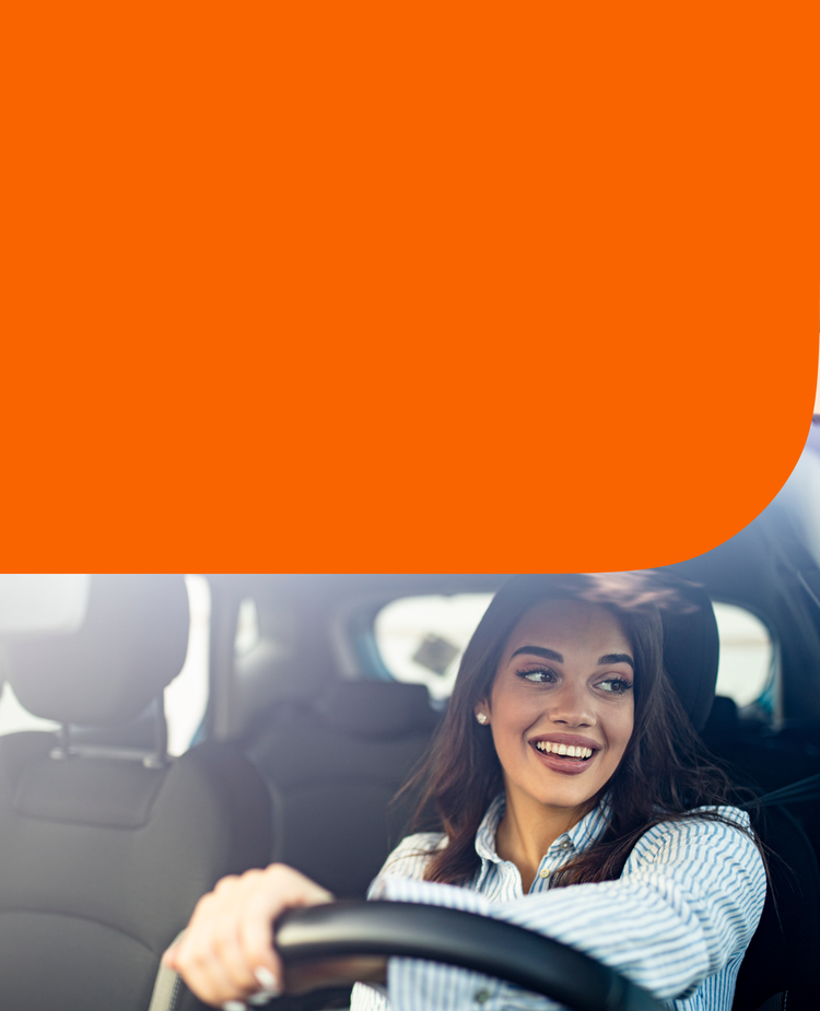 A woman behind the wheel of a car
