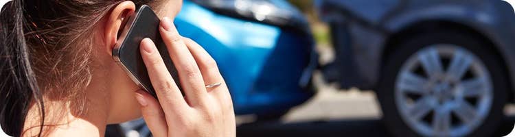 woman phones for help after car accident