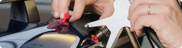 close-up of car dent removal tool