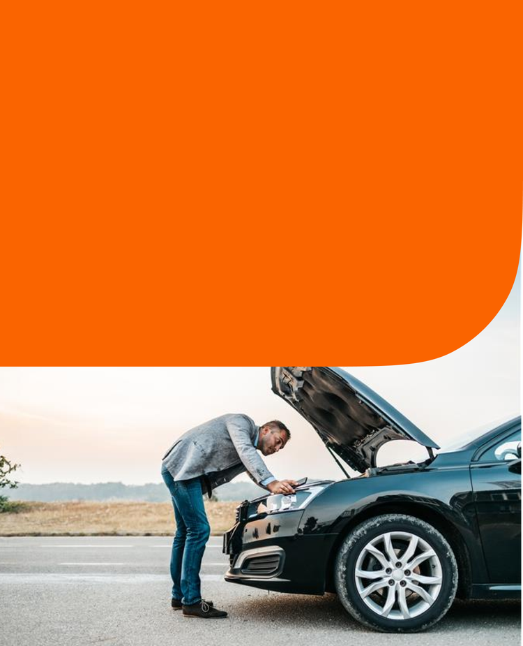 A man fixes his car.