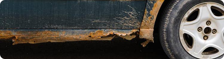 close up rusty bottom edge of vehicle