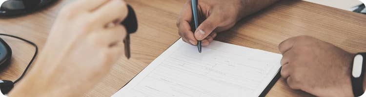 new car owner signs paperwork gets handed keys