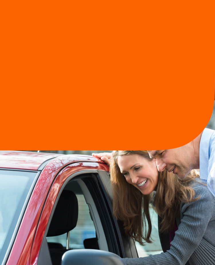 A couple evaluates a used car