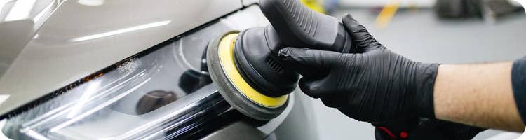 man using car buffing machine