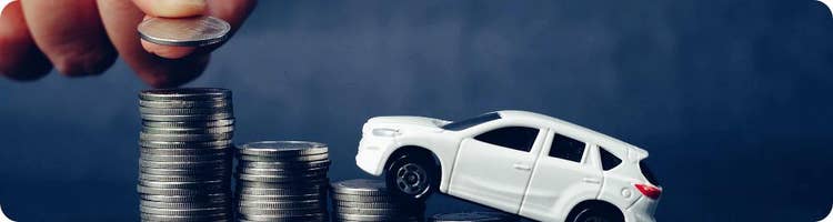 toy car on piles of coins